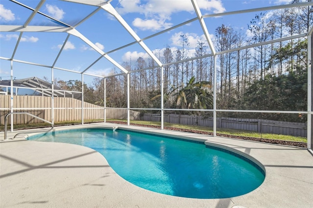 view of pool with a lanai and a patio area