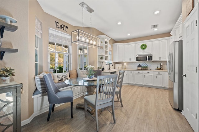 dining area featuring light wood-type flooring