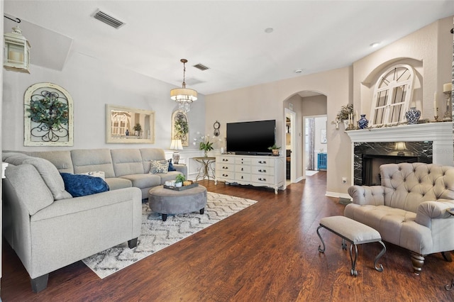 living room with a fireplace and dark hardwood / wood-style flooring