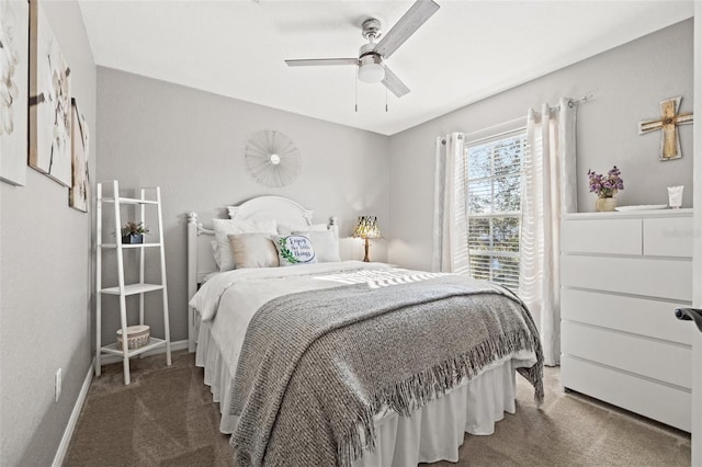 bedroom with dark colored carpet and ceiling fan