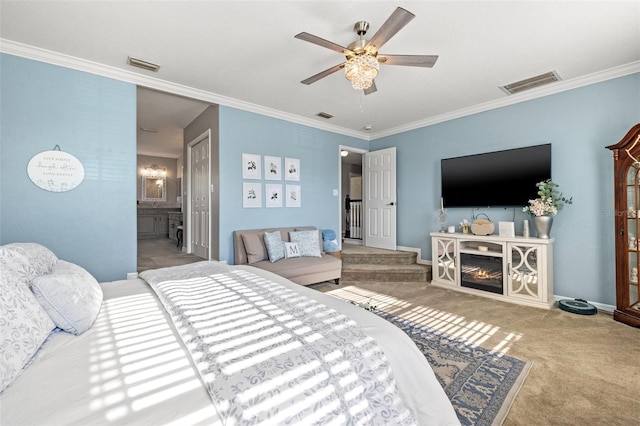 carpeted bedroom with ornamental molding, ceiling fan, and ensuite bathroom