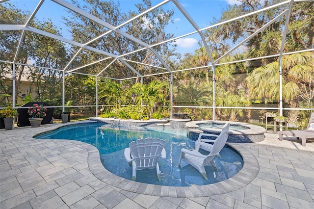 view of pool featuring an in ground hot tub, a lanai, and a patio