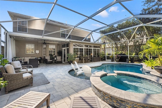 view of swimming pool with an outdoor living space, a patio, glass enclosure, and an in ground hot tub