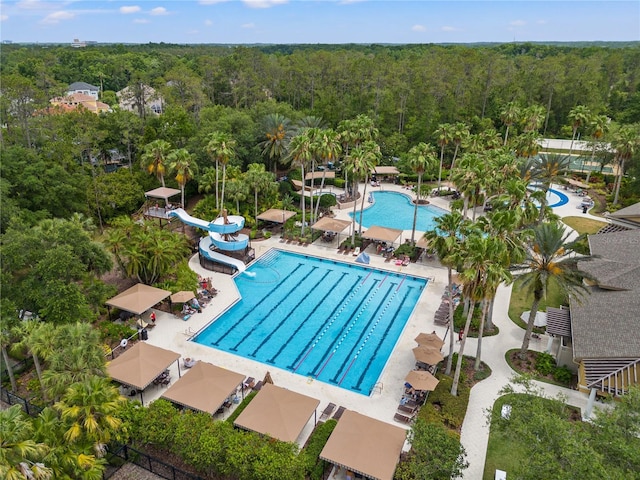 view of pool with a patio area and a water slide