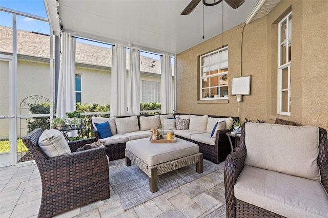 sunroom with ceiling fan