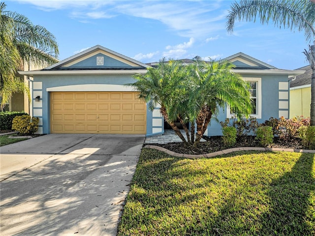 single story home with a garage and a front lawn