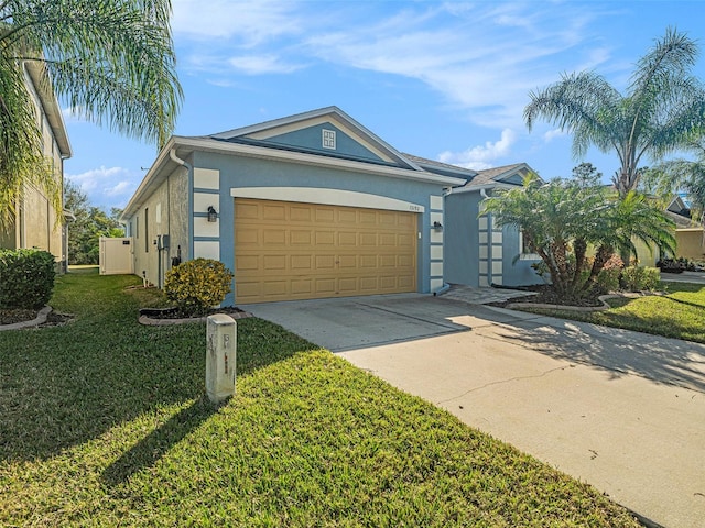 ranch-style house with a garage and a front yard