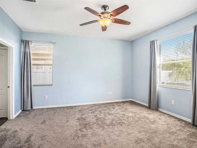 unfurnished bedroom with ceiling fan and carpet