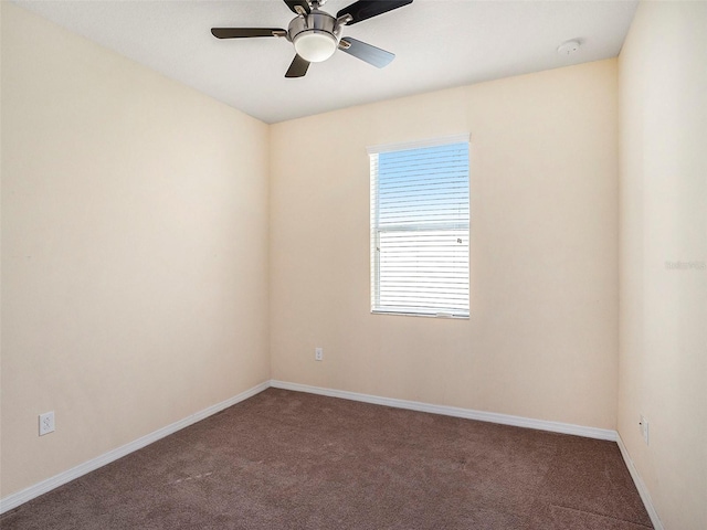 unfurnished room with carpet and ceiling fan