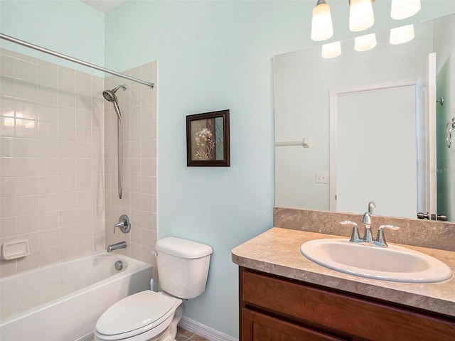 full bathroom featuring vanity, toilet, and tiled shower / bath