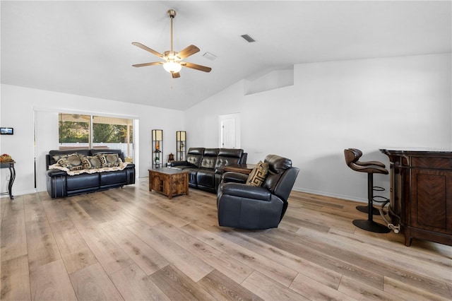 living room featuring light hardwood / wood-style flooring, high vaulted ceiling, and ceiling fan