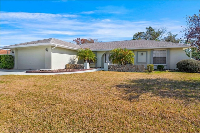 ranch-style home with a garage and a front lawn