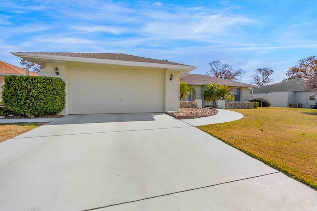 single story home with a garage and a front yard