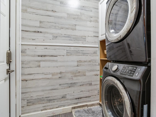 clothes washing area with stacked washer / drying machine