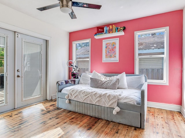 living area featuring ceiling fan and light hardwood / wood-style flooring