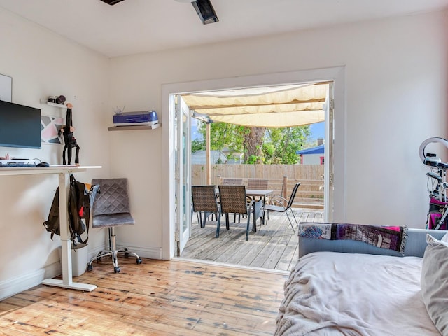 bedroom featuring access to outside and light wood-type flooring