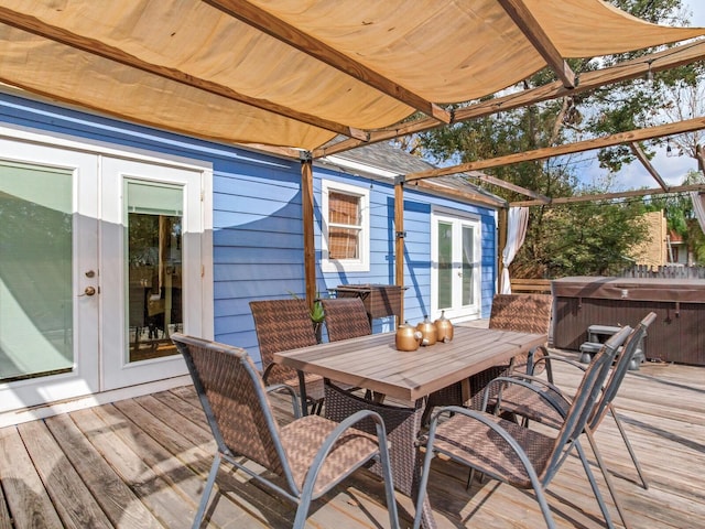 deck featuring a hot tub and french doors