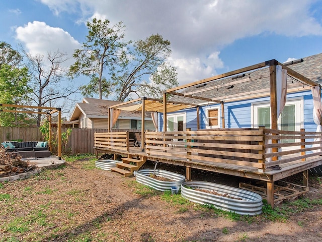 rear view of property with a wooden deck