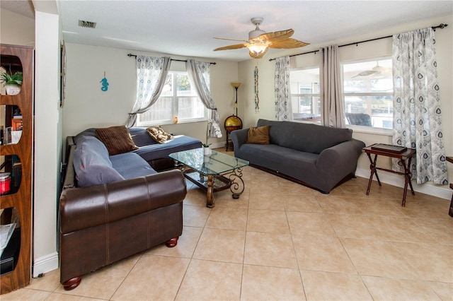 tiled living room featuring ceiling fan