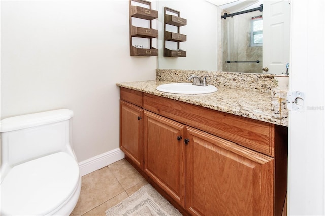 bathroom featuring vanity, toilet, and tile patterned flooring