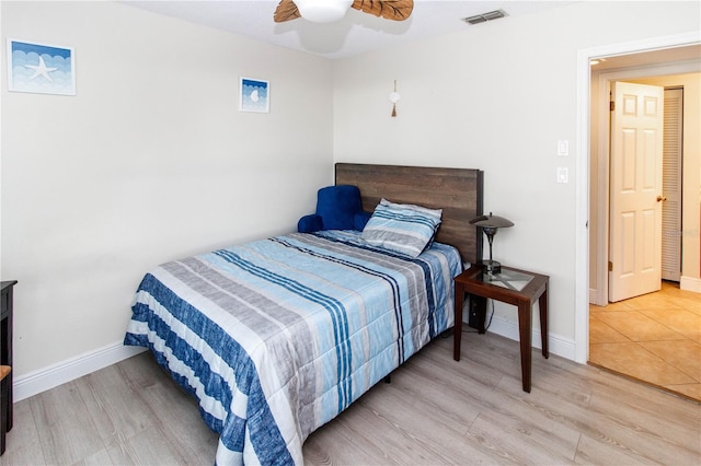 bedroom featuring wood-type flooring and ceiling fan