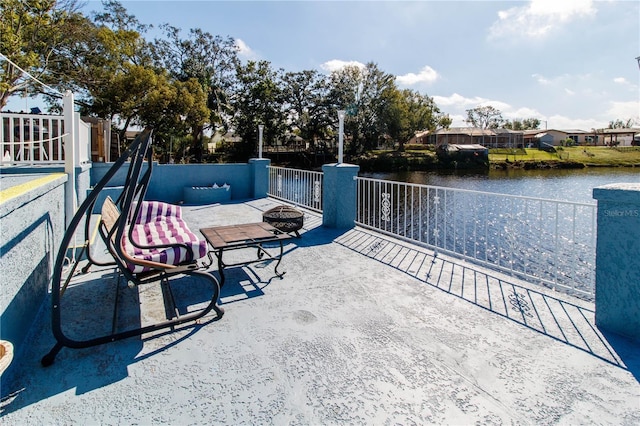 view of patio featuring a water view