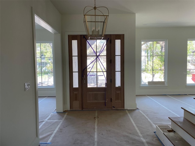 foyer with a notable chandelier