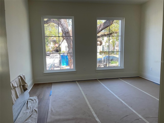 interior space with plenty of natural light and baseboards