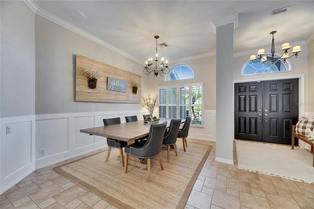 dining room featuring an inviting chandelier and crown molding