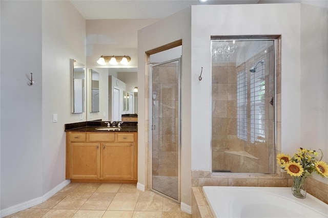 bathroom featuring tile patterned flooring, vanity, and separate shower and tub