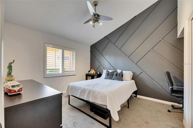 carpeted bedroom with ceiling fan and vaulted ceiling