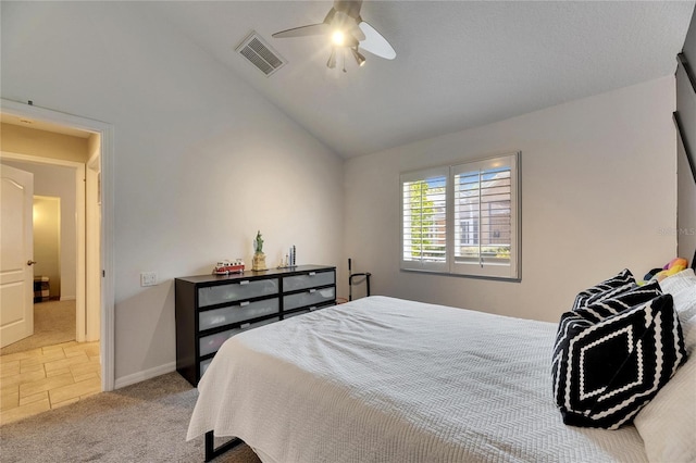 carpeted bedroom featuring ceiling fan and vaulted ceiling