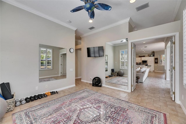 interior space featuring ornamental molding and ceiling fan