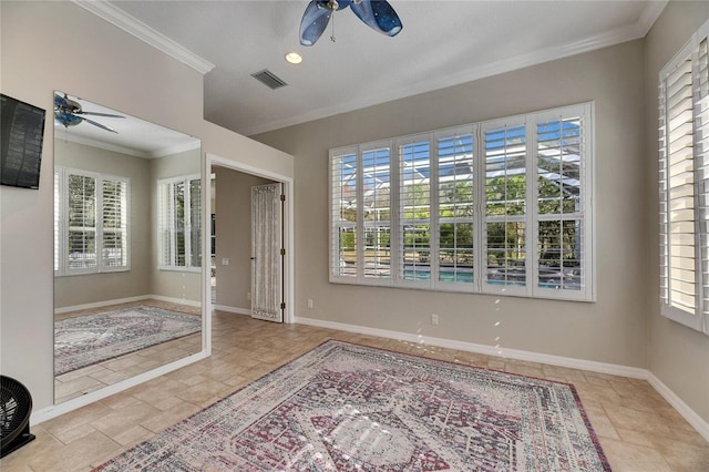 empty room featuring crown molding and ceiling fan