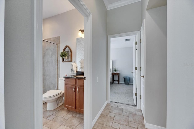 bathroom featuring vanity, toilet, and a shower