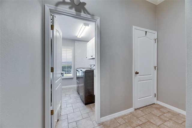 corridor with washer and dryer