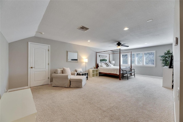 carpeted bedroom with ceiling fan, lofted ceiling, and a textured ceiling