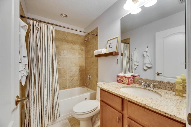 full bathroom featuring vanity, a textured ceiling, toilet, and shower / bath combo with shower curtain