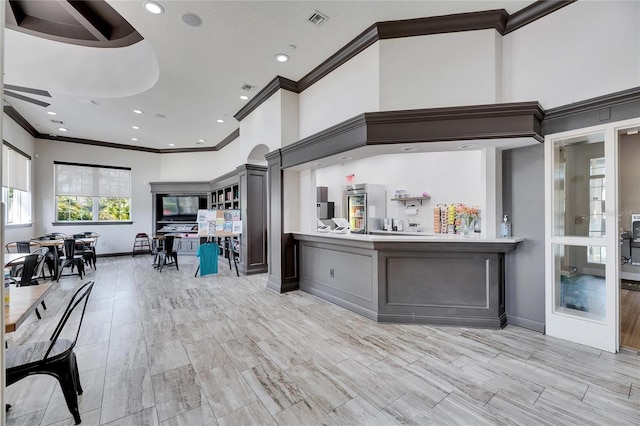 kitchen featuring ornamental molding and ceiling fan