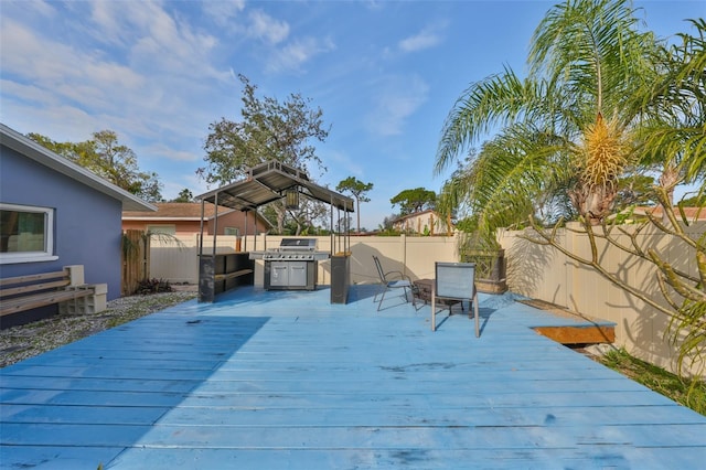 deck featuring a gazebo and grilling area