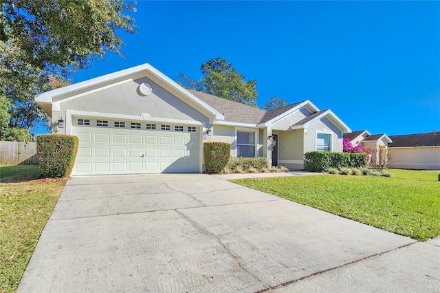 single story home with a garage and a front yard