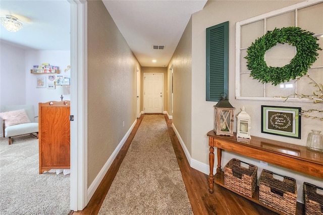 corridor featuring dark hardwood / wood-style floors