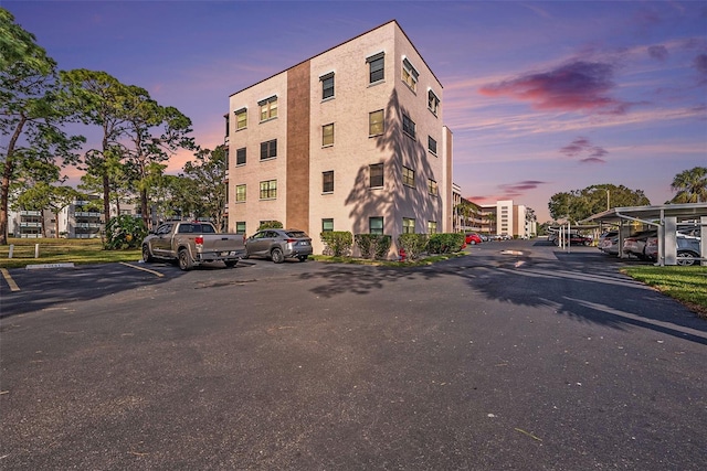 view of outdoor building at dusk