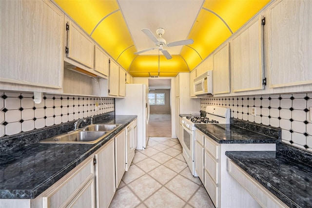 kitchen featuring ceiling fan, sink, light brown cabinets, and white appliances