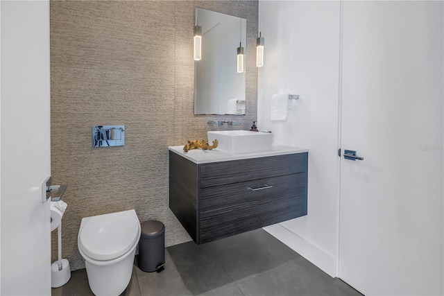 bathroom with vanity, toilet, and tile patterned flooring