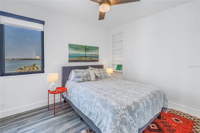 bedroom featuring hardwood / wood-style flooring and ceiling fan