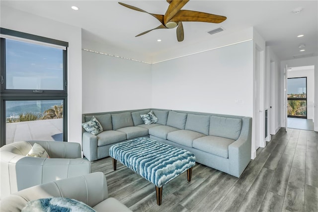 living room with hardwood / wood-style flooring and ceiling fan