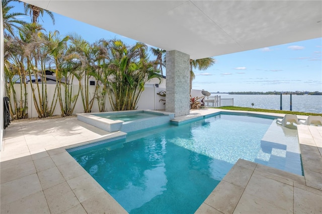 view of swimming pool with a water view, an in ground hot tub, and a patio area