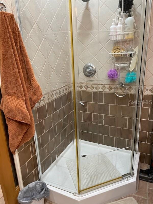 bathroom with an enclosed shower