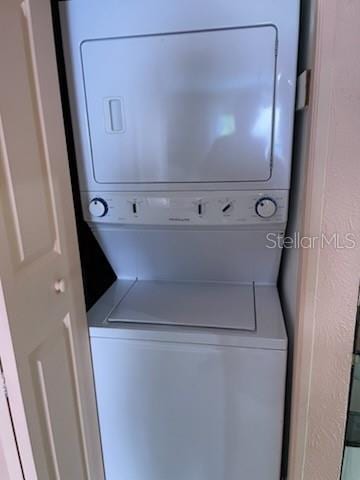 washroom with stacked washer and dryer